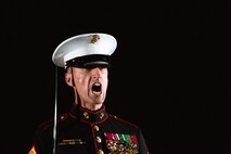 Sergeant Maj. Adrian Tagliere, sergeant major, Marine Barracks Washington, issues commands during the Friday Evening Parade at MBW, July 30, 2021.