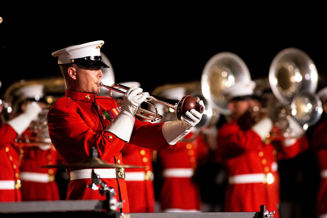 Sgt. Teal Ewer, bugler, “The Commandant’s Own,” U.S. Marine Drum & Bugle Corps, performs a solo during the Friday Evening Parade at Marine Barracks Washington, July 30, 2021. The guest of honor for the evening was The Honorable Kathleen H. Hicks, 35th Deputy Secretary of Defense, and the hosting official was Gen. David H. Berger, 38th Commandant of the Marine Corps. (U.S. Marine Corps photo by Lance Cpl. Tanner D. Lambert)