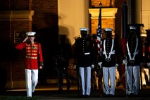 Captain Nathan D. Morris, assistant director, “The Commandant’s Own,” U.S. Marine Drum and Bugle Corps, salutes the national ensign during the Friday Evening Parade at Marine Barracks Washington, July 30, 2021