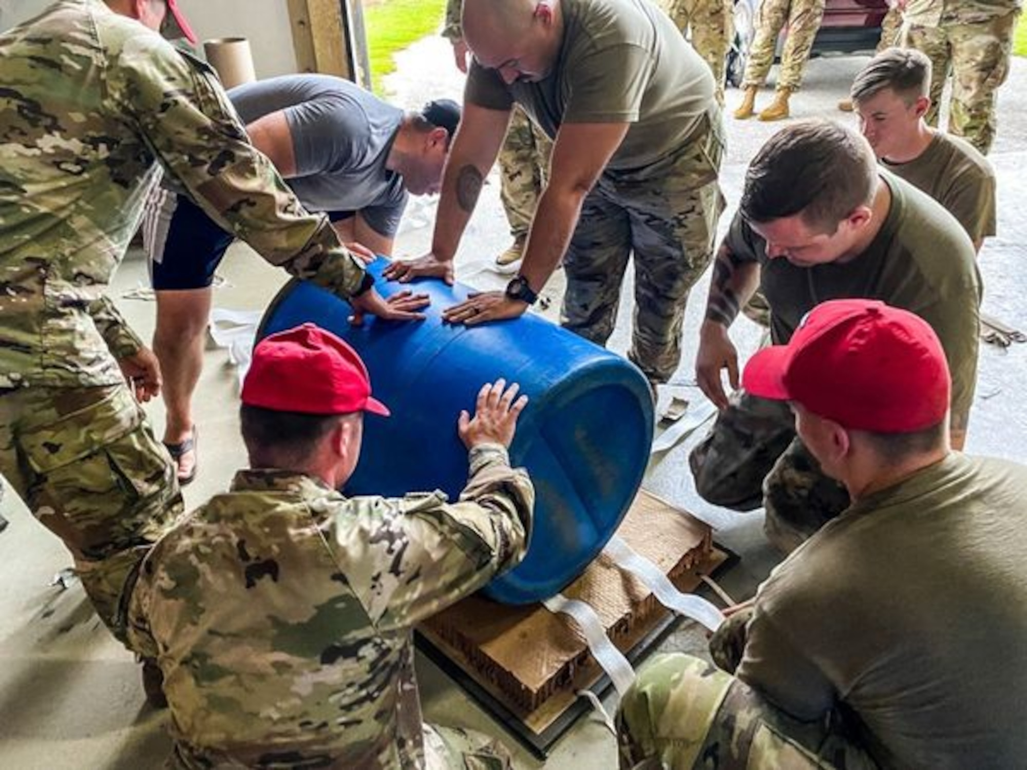 A crew comprised of U.S. Army parachute riggers with Group Support Battalion, 1st Special Forces Group (Airborne), 82nd Airborne Division, and a parachute rigger assigned to U.S. Navy Special Warfare Command built and apparatus at Andersen Air Force Base, Guam, to deliver medical supplies to an injured service member aboard a vessel out at sea, July 25, 2021.  The parachute riggers are currently supporting exercise Forager 21, which is a U.S. Army Pacific exercise designed to exercise Joint-integrated operations just like this rescue mission was.
