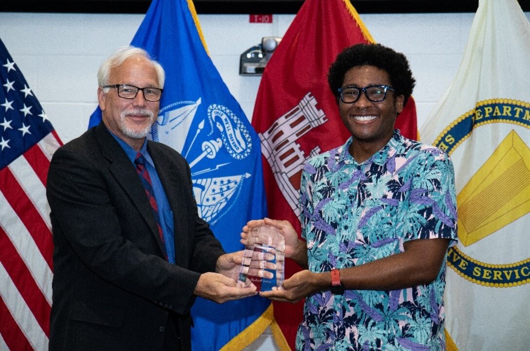 Dr. Joseph Corriveau, the director of the U.S. Army Engineer Research and Development Center’s Cold Regions Research and Engineer Laboratory (CRREL), presents Robert “RJ” Jones with the CRREL Award for Excellence during CRREL’s annual Engineer Day celebration July 15, 2021, in Hanover, New Hampshire. The annual Engineer Day event provides the opportunity for the laboratory to commemorate employee accomplishments from the previous year. (U.S. Army Corps of Engineers photo by David I. Marquis)