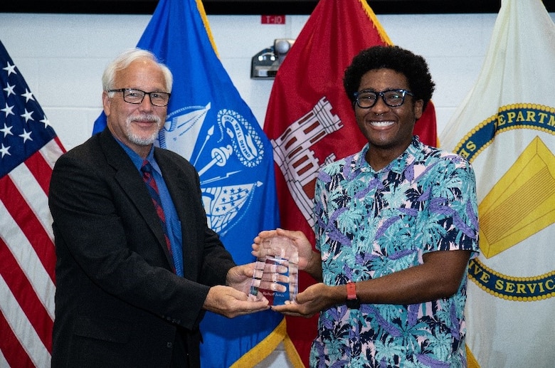 Dr. Joseph Corriveau, the director of the U.S. Army Engineer Research and Development Center’s Cold Regions Research and Engineer Laboratory (CRREL), presents Robert “RJ” Jones with the CRREL Award for Excellence during CRREL’s annual Engineer Day celebration July 15, 2021, in Hanover, New Hampshire. The annual Engineer Day event provides the opportunity for the laboratory to commemorate employee accomplishments from the previous year. (U.S. Army Corps of Engineers photo by David I. Marquis)