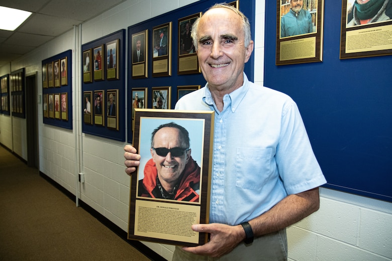 Dr. Don Perovich holds a plaque in the U.S. Army Engineer Research and Development Center’s (ERDC) Cold Regions Research and Engineering Laboratory’s (CRREL) Gallery of Distinguished Employees in Hanover, New Hampshire, July 15, 2021. CRREL leadership announced Perovich as the newest employee to be recognized in the gallery during CRREL's annual Engineer Day celebration, which provides the opportunity for the laboratory to commemorate employee accomplishments from the previous year. (U.S. Army Corps of Engineers photo by David I. Marquis)