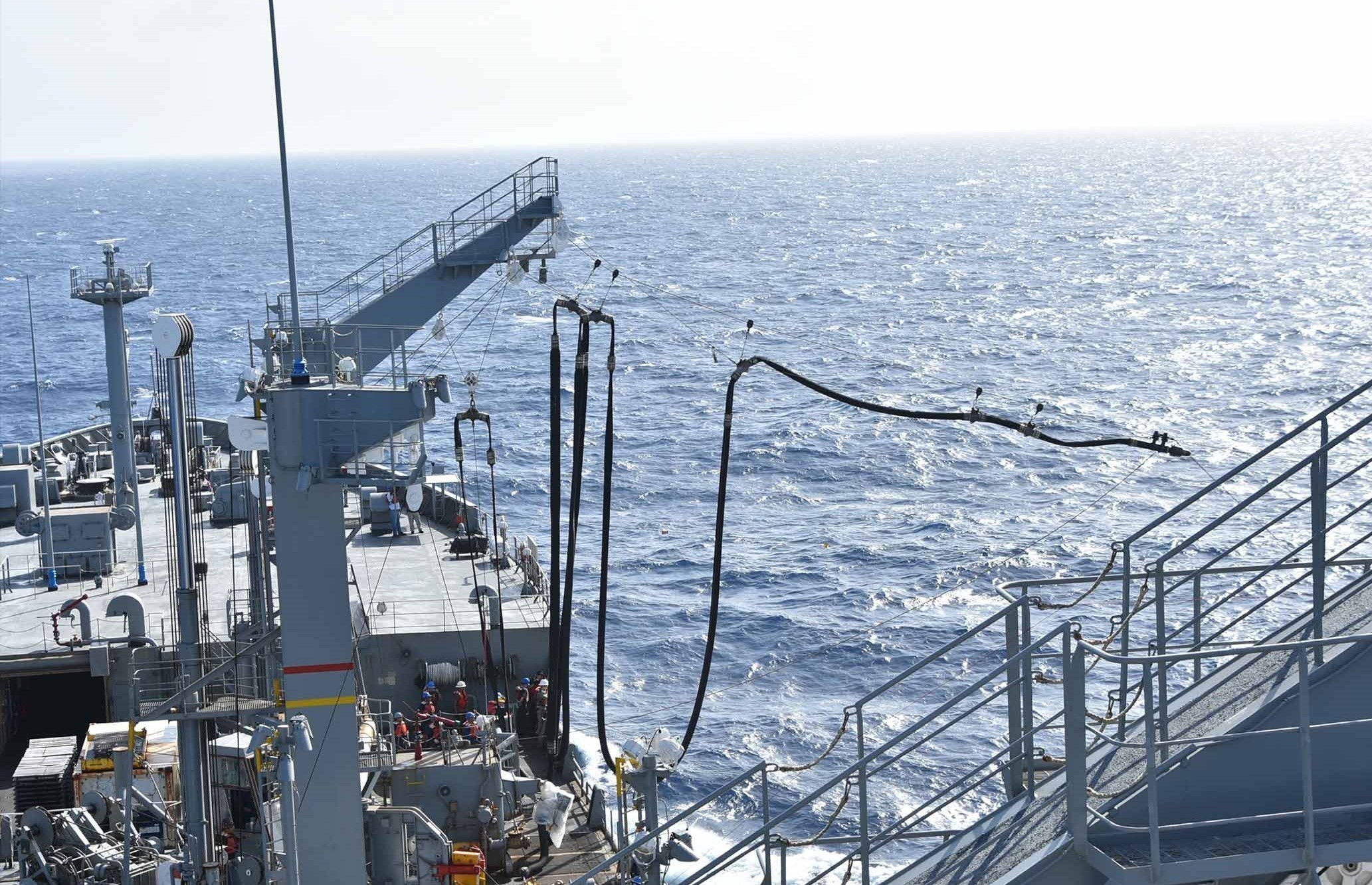 The Military Sealif Command Henry J. Kaiser-class underway replenishment oiler USNS Tippecanoe (T-AO 199) prepares for an underway replenishment with the Arleigh Burke-class guided-missile destroyer USS The Sullivans (DDG 68) in the South China Sea.