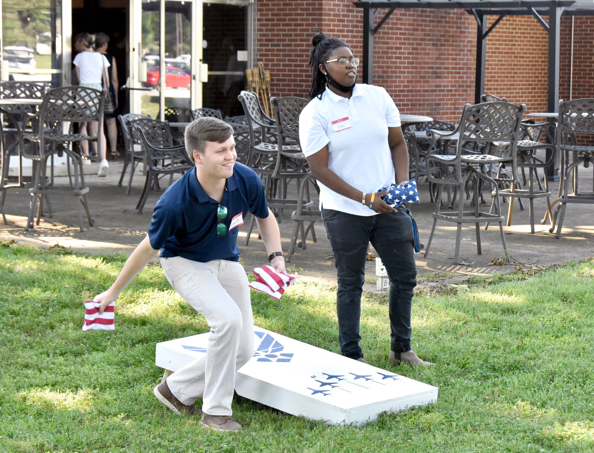 James Bailey and Zhuri Winfree-Givens, summer interns at Arnold Air Force Base, Tenn., play corn hole during a social event June 17, 2021, at the Arnold Lakeside Complex. Leadership with the Department of Defense and Arnold Engineering Development Complex Test Operations and Sustainment contractor, National Aerospace Solutions, LLC, were also in attendance to welcome and speak to the group. (U.S. Air Force photo by Bradley Hicks)