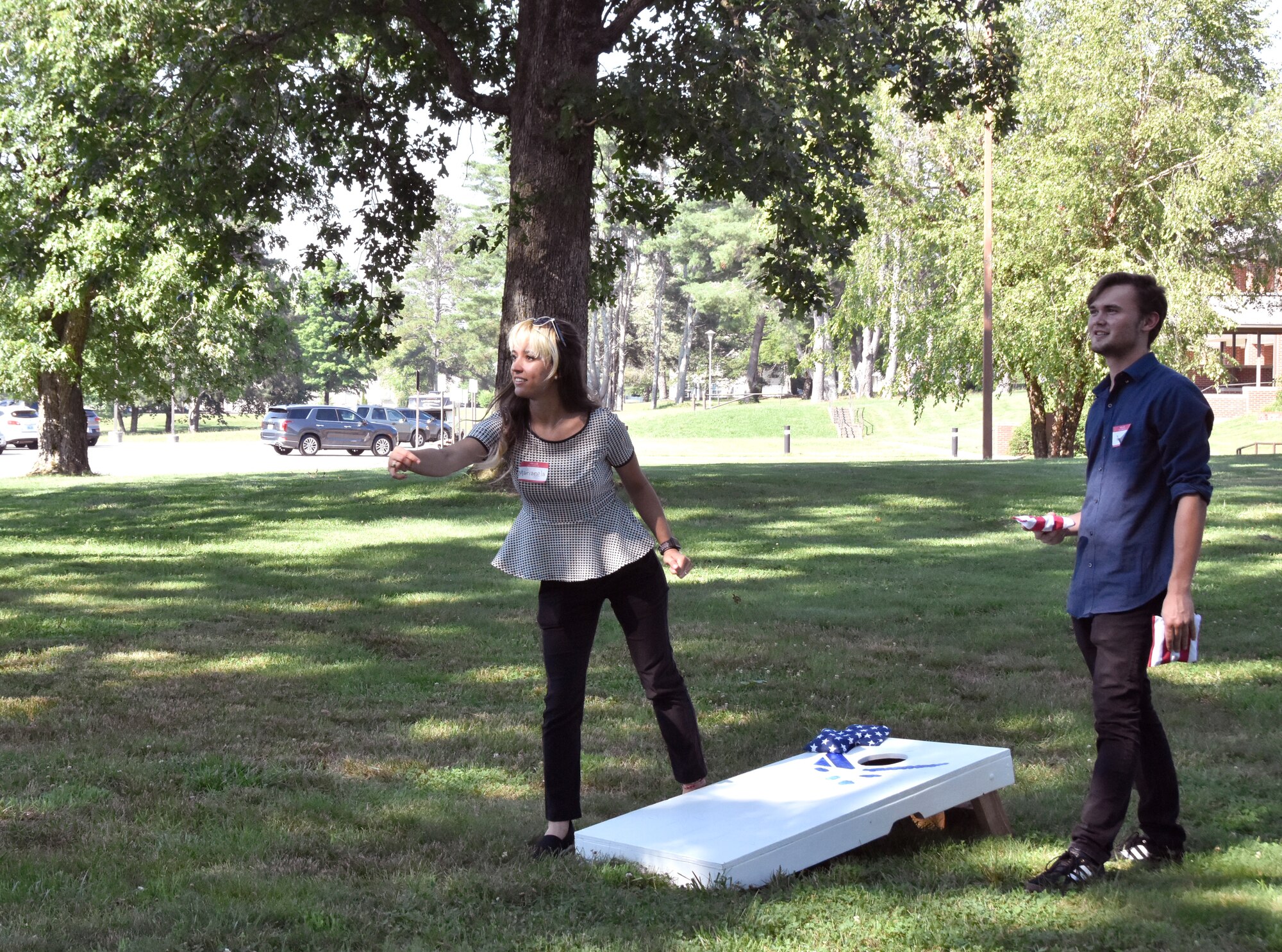Marianela Cintron and Joe Kennedy, summer interns at Arnold Air Force Base, Tenn., play corn hole during a social event June 17, 2021, at the Arnold Lakeside Complex. For the second year, Department of Defense and contractor interns with National Aerospace Solutions, LLC, are joining together for their internship programs at Arnold. (U.S. Air Force photo by Bradley Hicks)