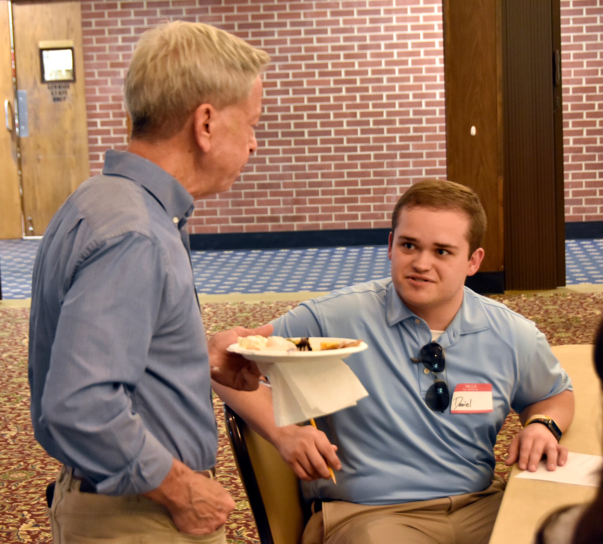 Mike Dent, chief of Technical Management, stops to chat with Daniel Waggoner during a social event for summer interns held June 17, 2021, at the Arnold Lakeside Complex on Arnold Air Force Base, Tenn. Leadership with both the Department of Defense and National Aerospace Solutions, LLC, coordinated the event. This is the second summer that NAS and DOD have joined together in hosting intern activities.  (U.S. Air Force photo by Bradley Hicks)