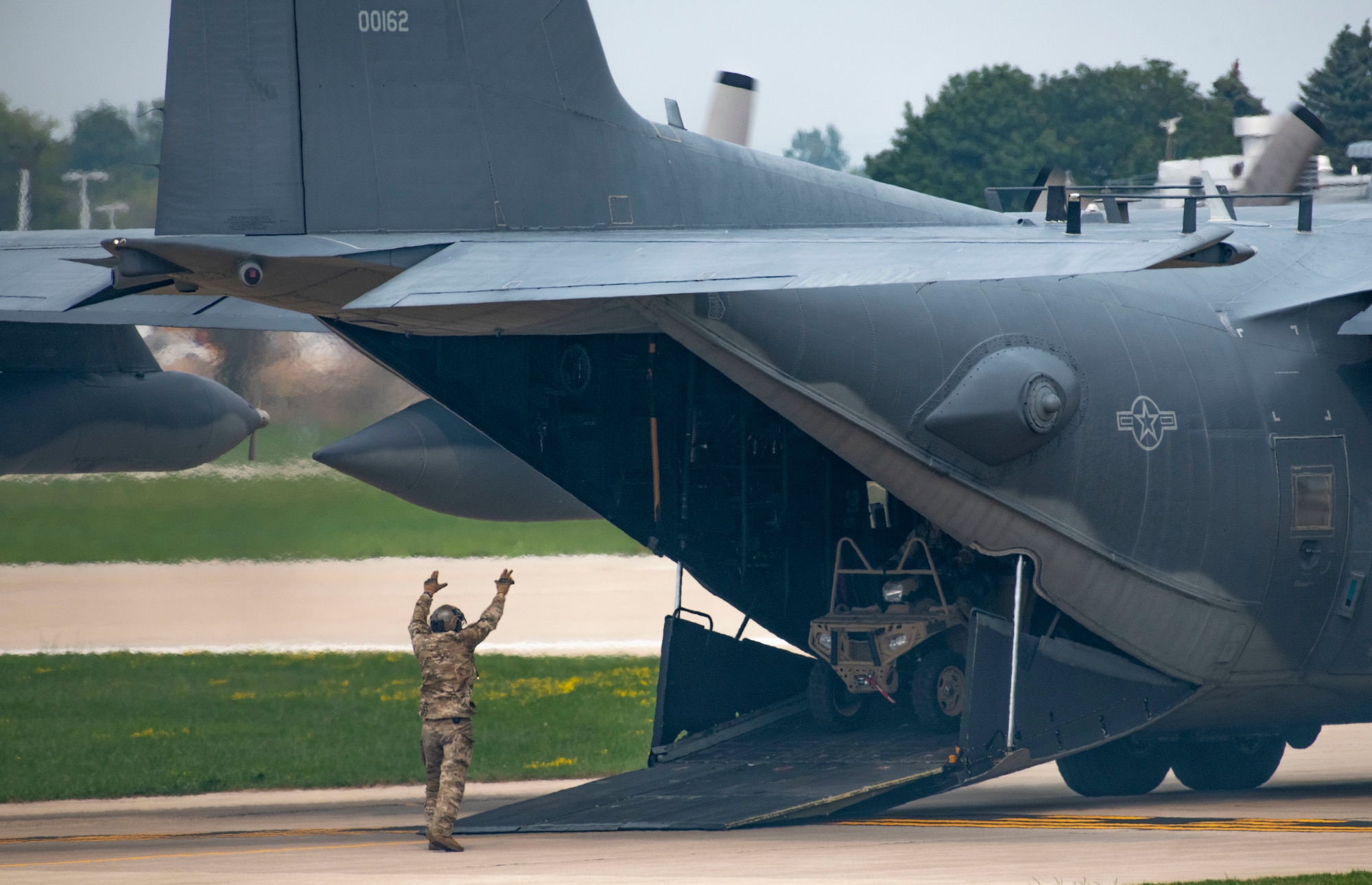 U.S. Air Force special tactics Airmen with Air Force Special Operations Command unload from a CV-22 Osprey during an airpower demonstration at Wittman Regional Airport, Wis., July 29, 2021.