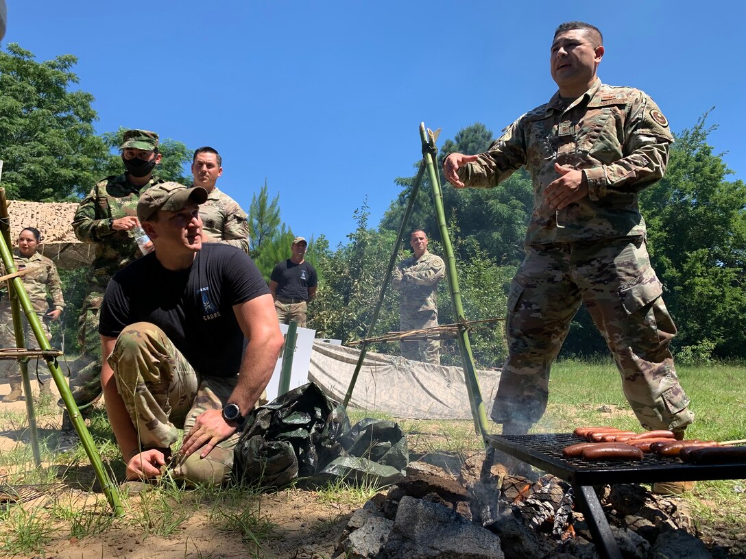 Air Force technical sergeant translates at a survival briefing.