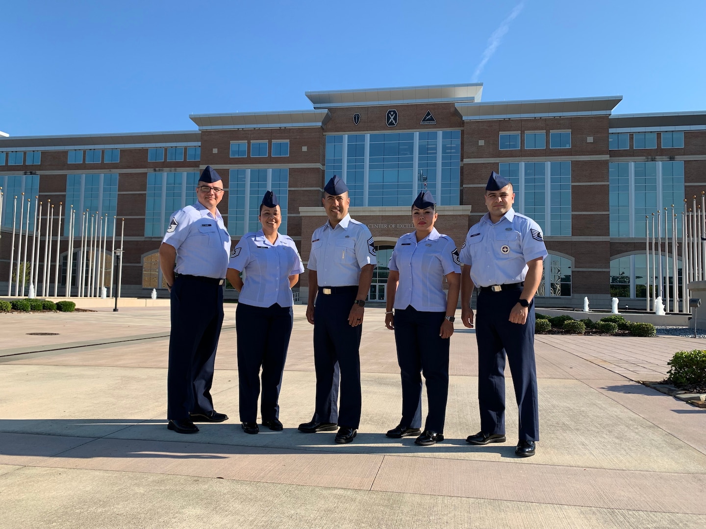 Five NCOs from IAAFA pose for group photo.