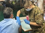 Virginia National Guard Soldiers conduct a mobile vaccination mission on board international ships in July 2021 in Norfolk, Virginia. The Virginia National Guard's support to Virginia's COVID-19 response ended July 31, 2021.