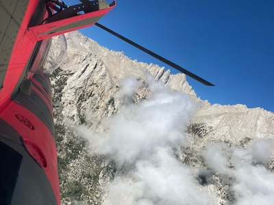 A U.S. Army CH-47F Chinook helicopter from the California Army National Guard’s Army Aviation Support Facility in Stockton, California, flies near Mount Whitney in Inyo County July 27, 2021, during a search and rescue mission for three hikers who were stranded above 12,600 feet overnight with few supplies.