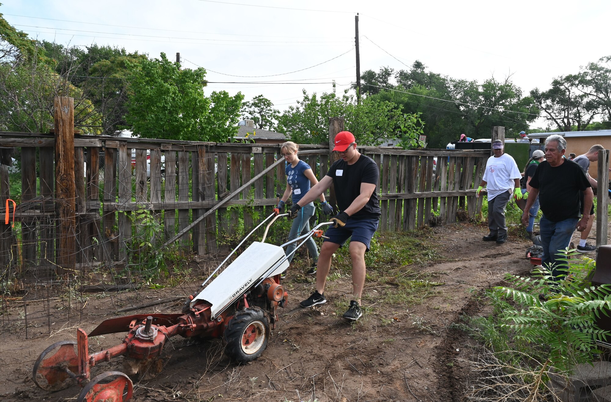 Removing trash from yard.