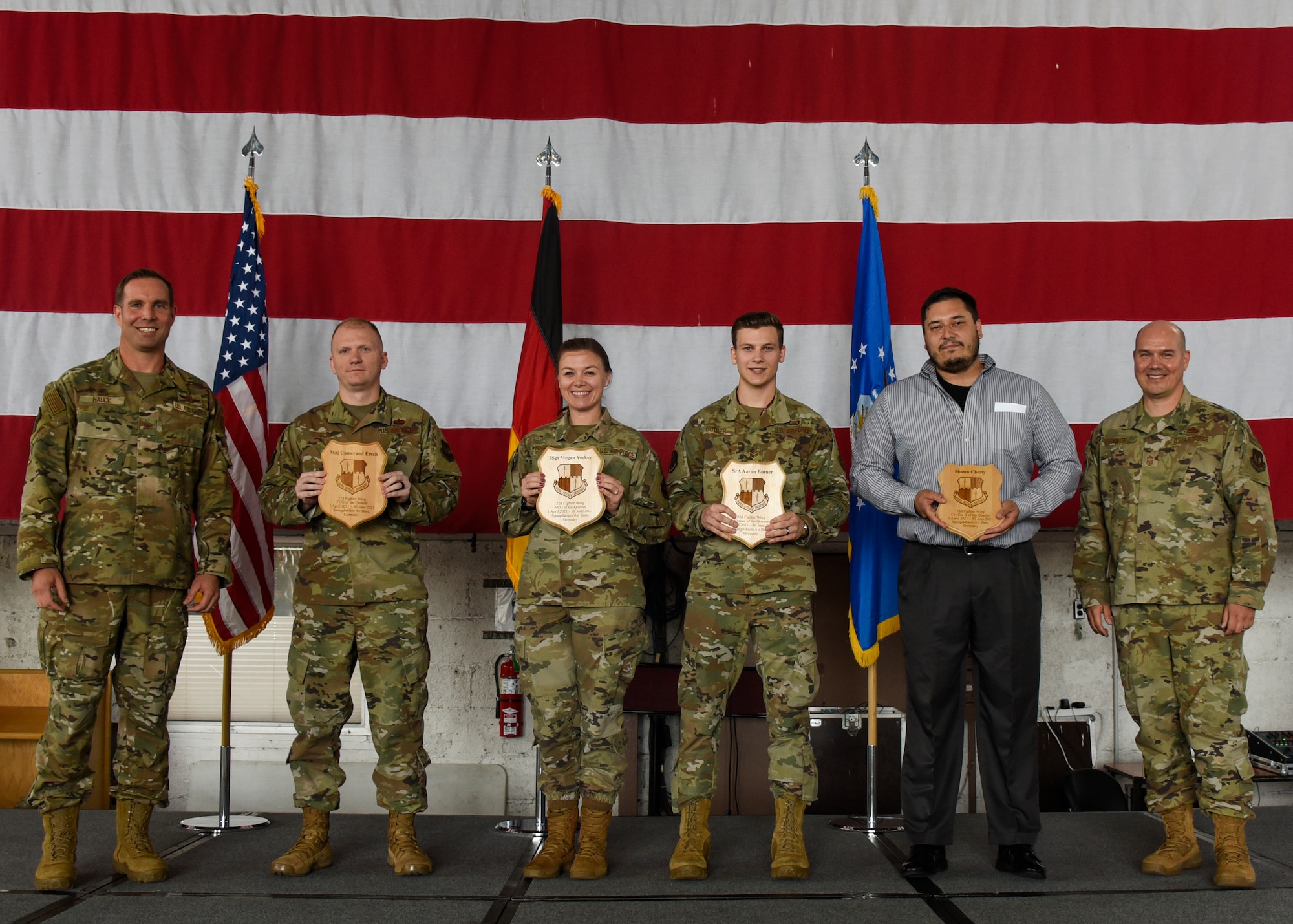 U.S. Air Force Col. Leslie Hauck, 52nd Fighter Wing commander, (far left), and Chief Master Sgt. Christopher Yager, 52nd Maintenance Squadron, (far right), pose for a photo with the 52nd Fighter Wing’s second -quarter  award winners on Spangdahlem Air Base, Germany, July 30, 2021.
