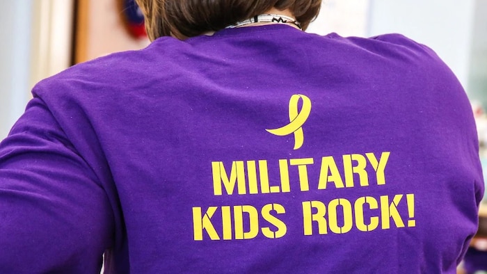 Public schools are now collecting data on the performance of military children. Here, teachers and students at Crossroads Elementary School, a DoD-run school at Quantico, Va., wear shirts honoring military children. (DoDEA)