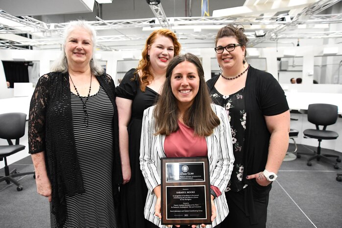 IMAGE: Sarah Moore, engineer in the Human Systems Integration (HSI) division and awardee of the 2021 G. Dennis White Early Career HSI Practitioner award, poses with the White family.