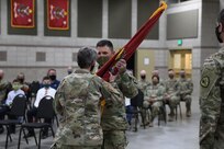 Maj. Barbara Blanke passes the guidon to 1st Sgt. Donnelly, the incoming first sergeant of HHD 640th Regiment, RTI, at Camp Williams, Utah, April 17, 2021