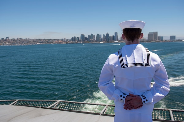 SAN DIEGO (August 2, 2021) A Sailor assigned to Nimitz-class aircraft carrier USS Carl Vinson (CVN 70) mans the rails on the flight deck.