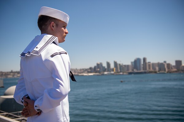 SAN DIEGO (August 2, 2021) A Sailor assigned to Nimitz-class aircraft carrier USS Carl Vinson (CVN 70) mans the rails on the flight deck.