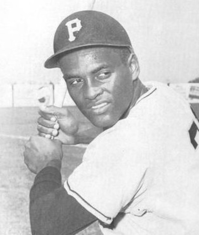 A baseball player prepares to swing a bat.