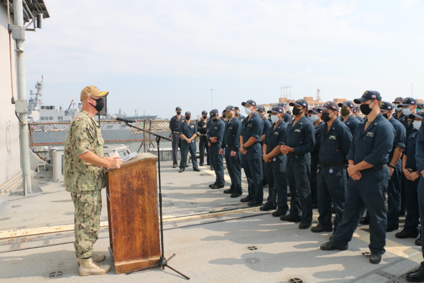 NAVAL STATION NORFOLK (Aug. 2, 2021) – Rear Adm. Brendan McLane, commander, Naval Surface Force Atlantic, speaks to the crew of the guided-missile cruiser USS San Jacinto (CG 56). McLane presented the crew with the Navy Unit Commendation for their leadership and hard work in support of the Dwight D. Eisenhower Carrier Strike Group during their 2020 deployment, which lasted 206 days with no port visits. (U.S. Navy photo by Boatswain’s Mate 3rd Class Danielle Bordine/Released)