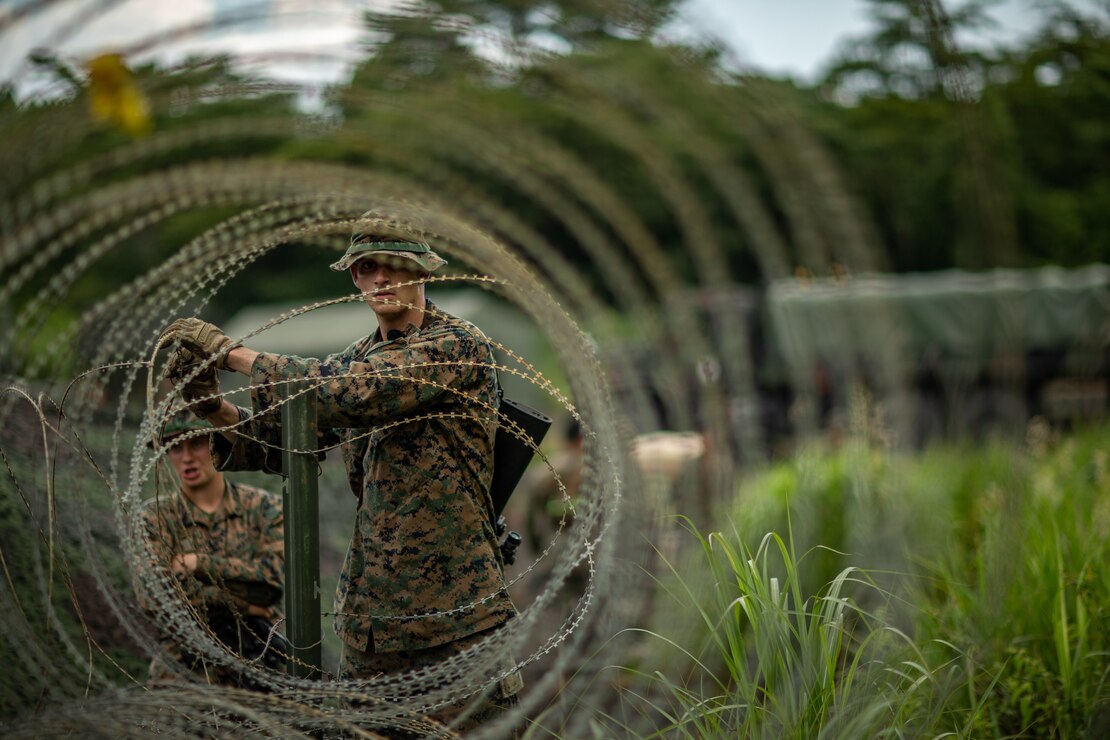 U.S. Marine Corps Lance Cpl. Jared Earp, a combat engineer with Marine Wing Support Squadron 171, sets up a controlled entry point at a forward arming and refueling point during exercise Eagle Wrath 21 at Combined Arms Training Center Camp Fuji, Japan, July 23, 2020. MWSS-171 trained with a variety of weapon systems and set up a forward arming and refueling point as part of unit-level training. The exercise is held annually in order to increase the squadron’s combat readiness.