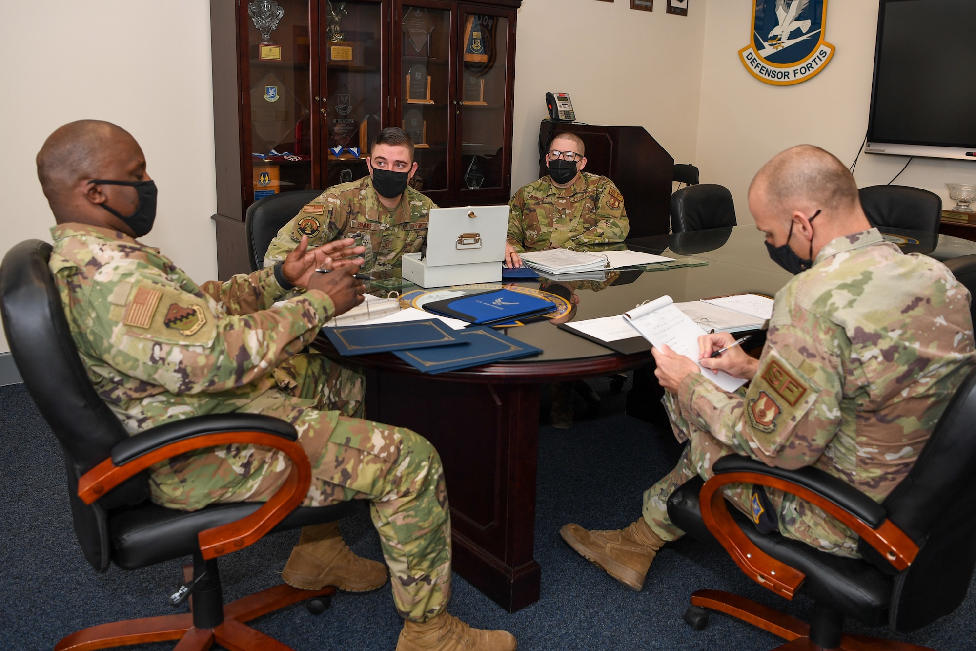 Airmen at conference table