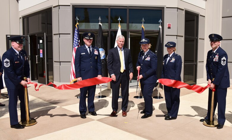 Past and present leadership of 14th Air Force, the Combined Force Space Component Command and Combined Space Operations Center help cut the ribbon of the new, state-of-the-art CFSCC and CSpOC building at Vandenberg Space Force Base, Calif., Aug. 2, 2021.