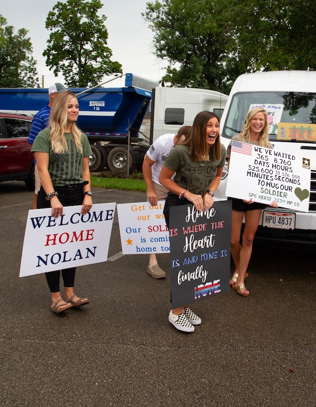 Family Members await the arrival of their Soldier from the 223rd Military Police Company after their deployment. The Soldiers arrived to Buechel National Guard Armory Aug 22 after recently returning from their overseas deployment