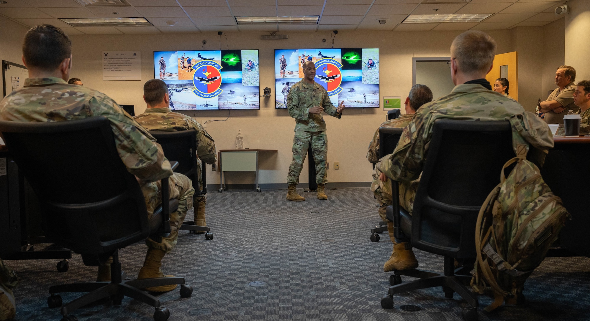 U.S. Air Force Lt. Col. Billy Wilson Jr., Department of the Air Force Airfield Operations Branch Chief, speaks to the first Landing Zone Operations Course students at Scott Air Force Base, Illinois, July 26, 2021. This is the first Headquarters Air Force sponsored Landing Zone Operations Course that will serve as the gold standard for training airfield operations professionals as well as others requiring the training for mission accomplishment.