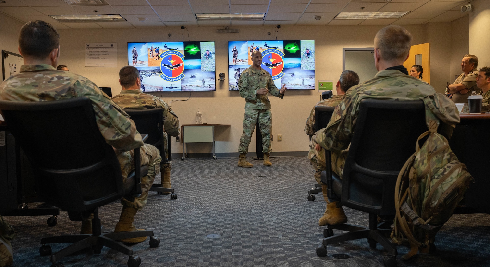 U.S. Air Force Lt. Col. Billy Wilson Jr., Department of the Air Force Airfield Operations Branch Chief, speaks to the first Landing Zone Operations Course students at Scott Air Force Base, Illinois, July 26, 2021. This is the first Headquarters Air Force sponsored Landing Zone Operations Course that will serve as the gold standard for training airfield operations professionals as well as others requiring the training for mission accomplishment.