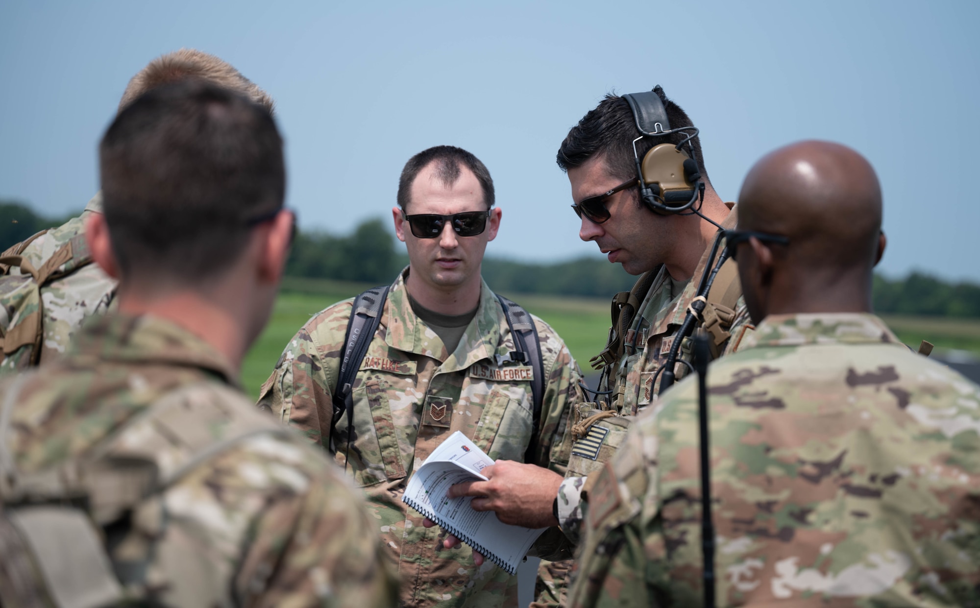U.S. Air Force Tech. Sgt. Ryan Rathke, Landing Zone Operations Course student, measures the length of a simulated landing zone at Schafer Field in St. Jacob, Illinois, July 30, 2021. As part of the Landing Zone Operations Course students simulate surveying a landing zone.