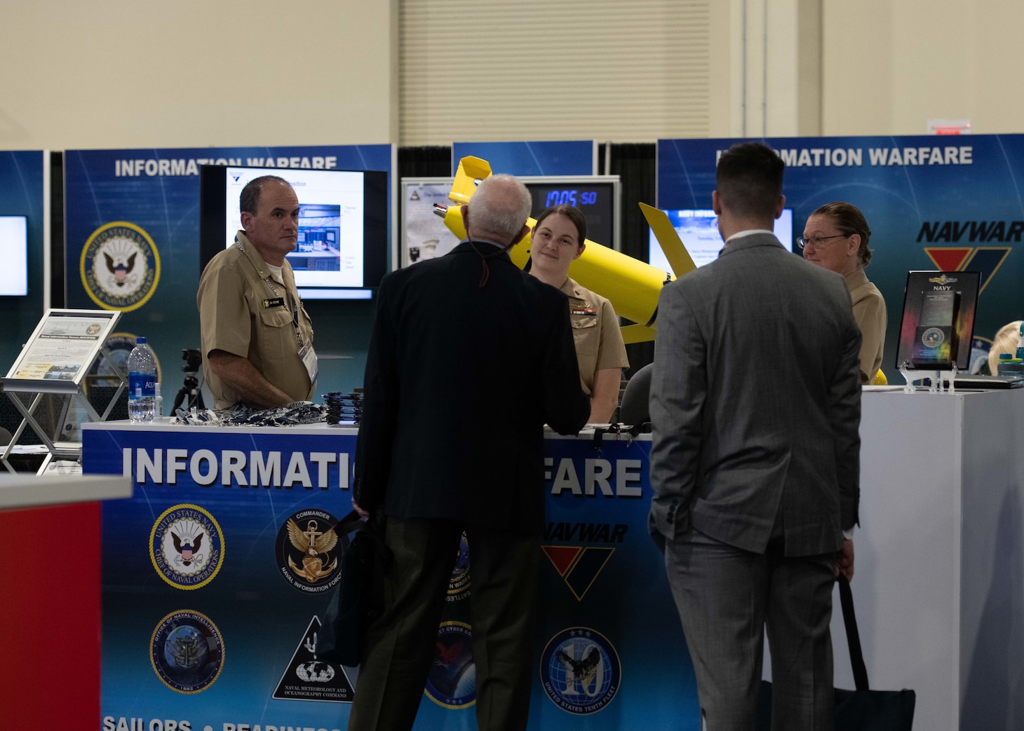 The Naval Information Warfare booth gives attendees information on the different specialties including intelligence, cryptologic warfare, and naval meteorology and oceanography at the Sea-Air-Space 2021 exposition.