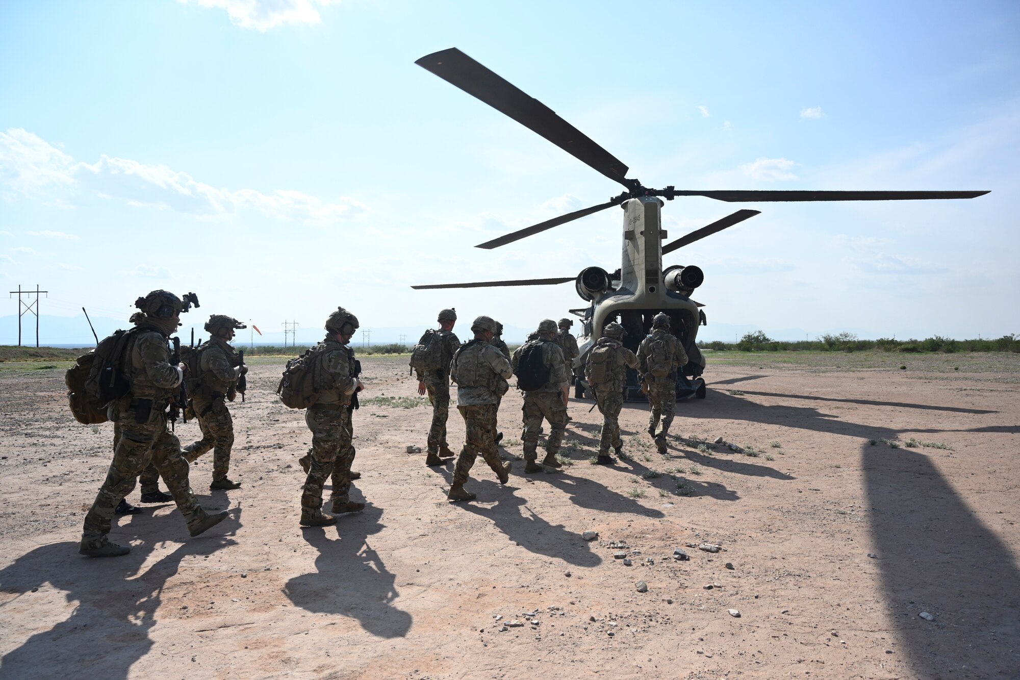 Exercise Zia Sun participants board a CH-47 Chinook before an infiltration exercise, July 20, 2021, on White Sands Missile Range, New Mexico. The exercise scenario tested their ability to contact and communicate with friendly aircrafts to ensure personnel are safely extracted. (U.S. Air Force photo by Airman 1st Class Adrian Salazar)