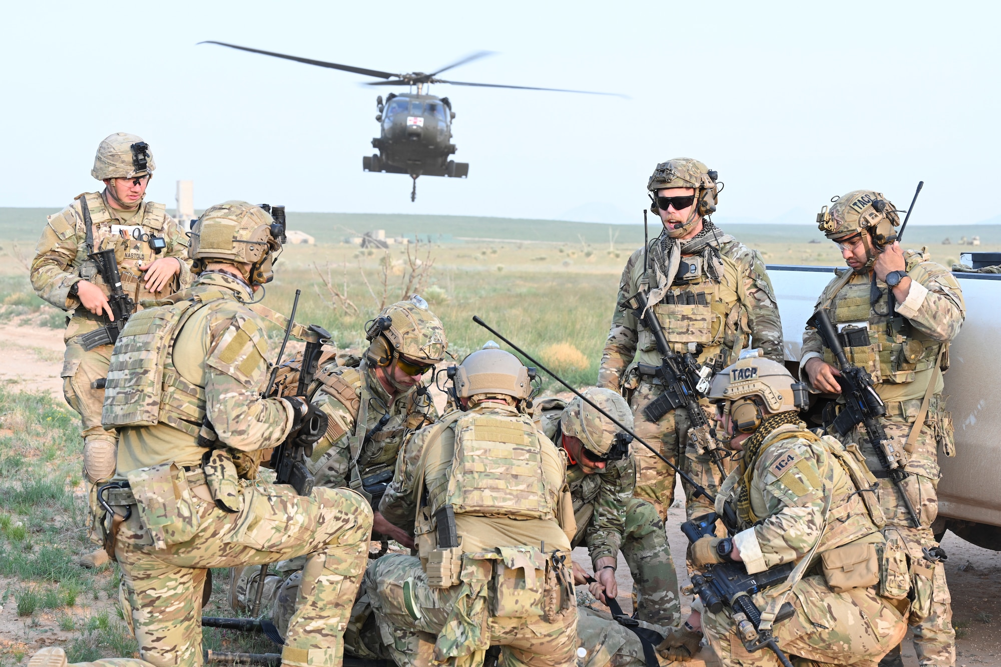 Exercise Zia Sun participants prepare a simulated patient for a medical evacuation on July 20, 2021, on White Sands Missile Range, New Mexico. Zia Sun is an annual exercise designed to provide realistic combat operations training involving joint and international partners and a variety of aircraft. (U.S. Air Force photo by Airman 1st Class Adrian Salazar)