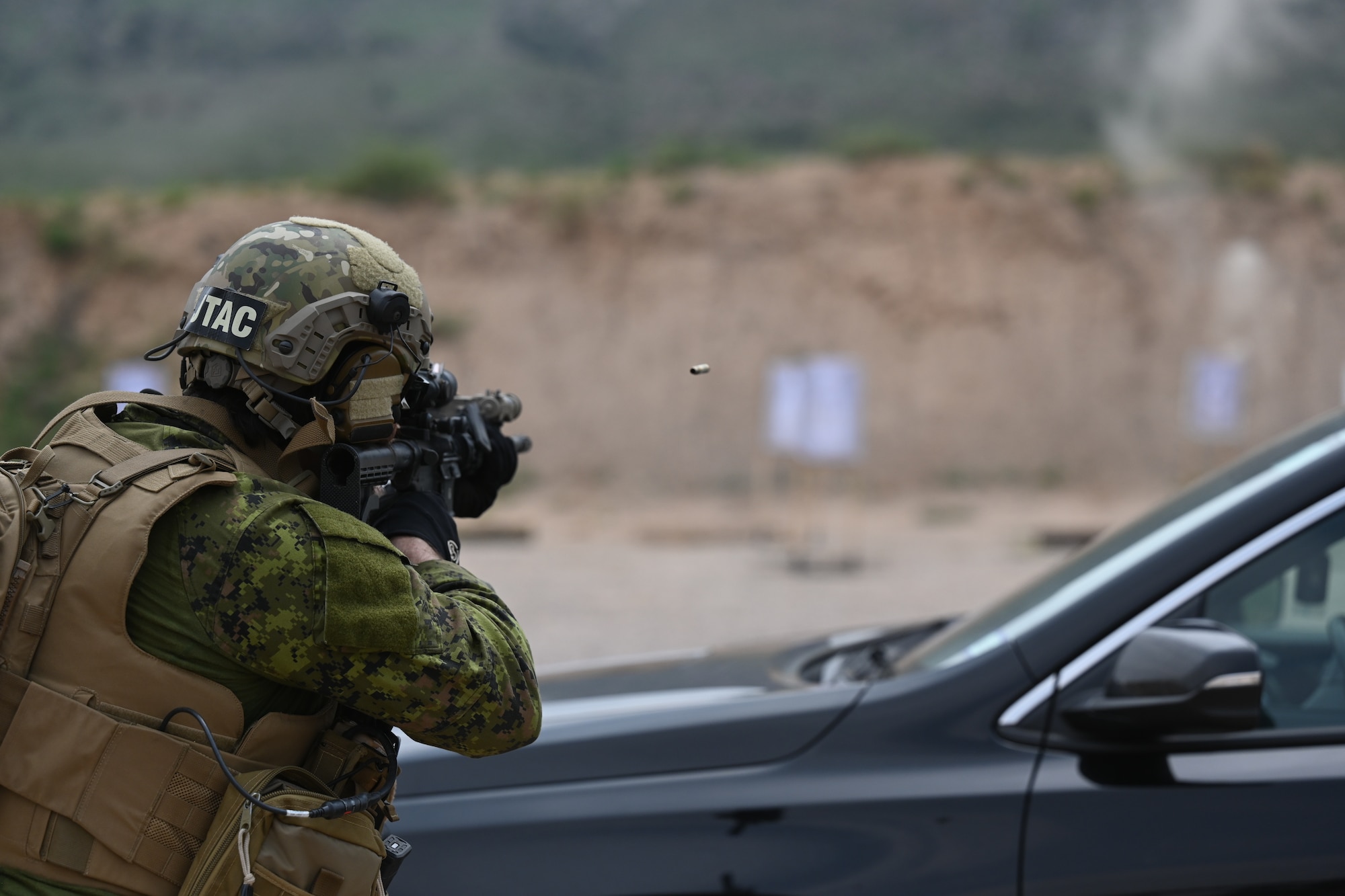 A member of the 2nd regiment Royal Canadian Horse Artillery Garrison shoots at a target during Exercise Zia Sun July 22, 2021, New Mexico. Zia Sun is an annual exercise designed to provide realistic combat operations training involving joint and international partners and a variety of aircraft. (U.S. Air Force Photo by Airman 1st Class Adrian Salazar)