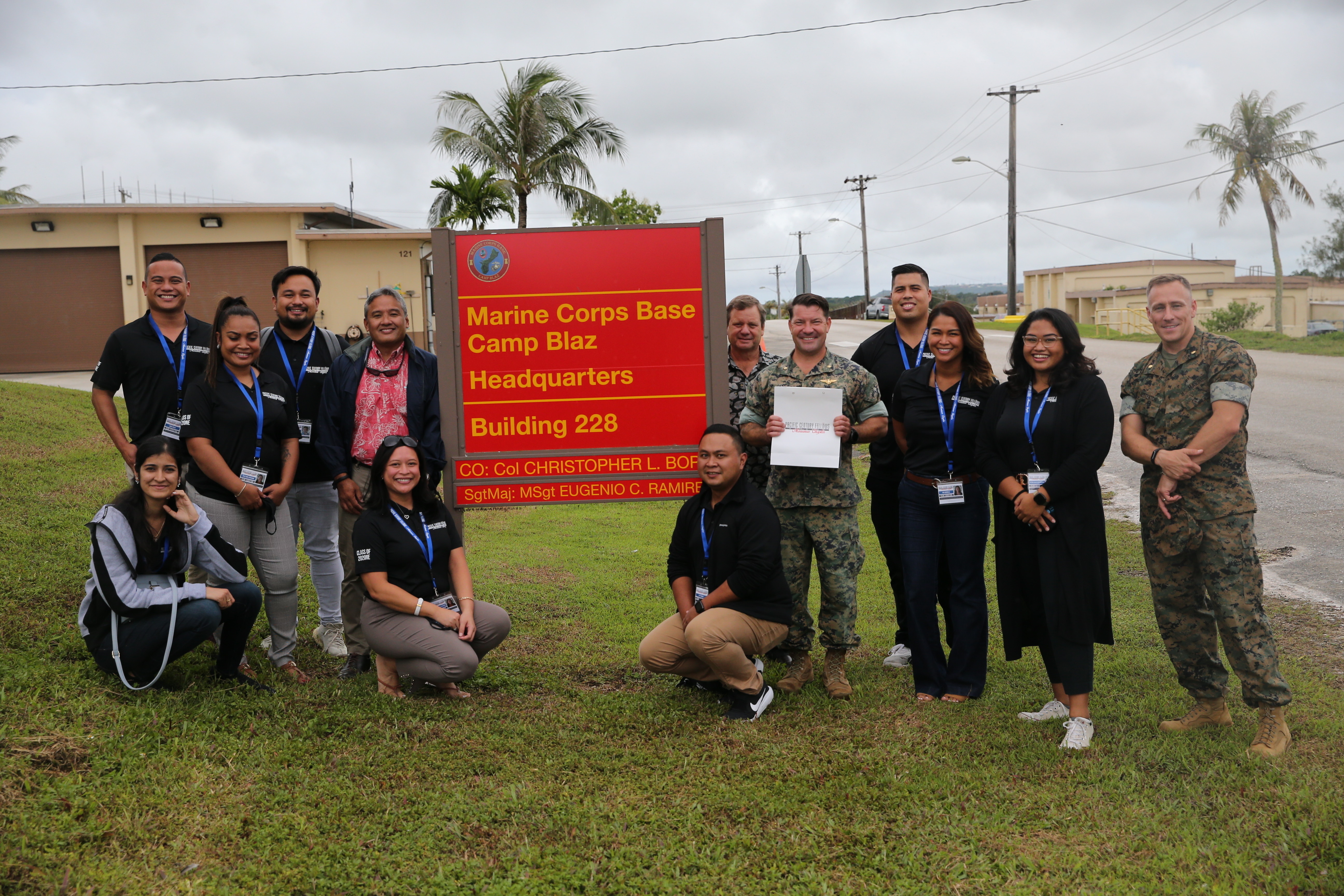 Marine Corps Base (MCB) Camp Blaz leaders pose for a photo with the Marianas Chapter of the Pacific Century Fellows during a visit to the base, July 29, 2021.