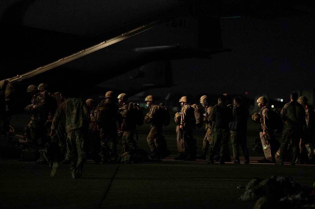 Japan Ground Self-Defense Force soldiers with the 1st Airborne Brigade board a C-130J Super Hercules assigned to the 36th Airlift Squadron during Exercise Forager 21 at Yokota Air Base, Japan, July 29, 2021.