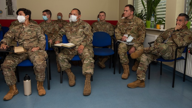 Members of the 480th Expeditionary Fighter Squadron and the 52nd Operations Group Detachment 1, listen to Polish firefighters assigned to the 32nd Tactical Air Base talk about emergency responder expectations at Łask Air Base, Poland, July 28, 2021. The event, which was in preparation for the upcoming Aviation Detachment Rotation, allowed attendees to review and discuss emergency response reaction time and the responsibilities of everyone involved. (U.S. Air Force photo by Tech. Sgt. Anthony Plyler)