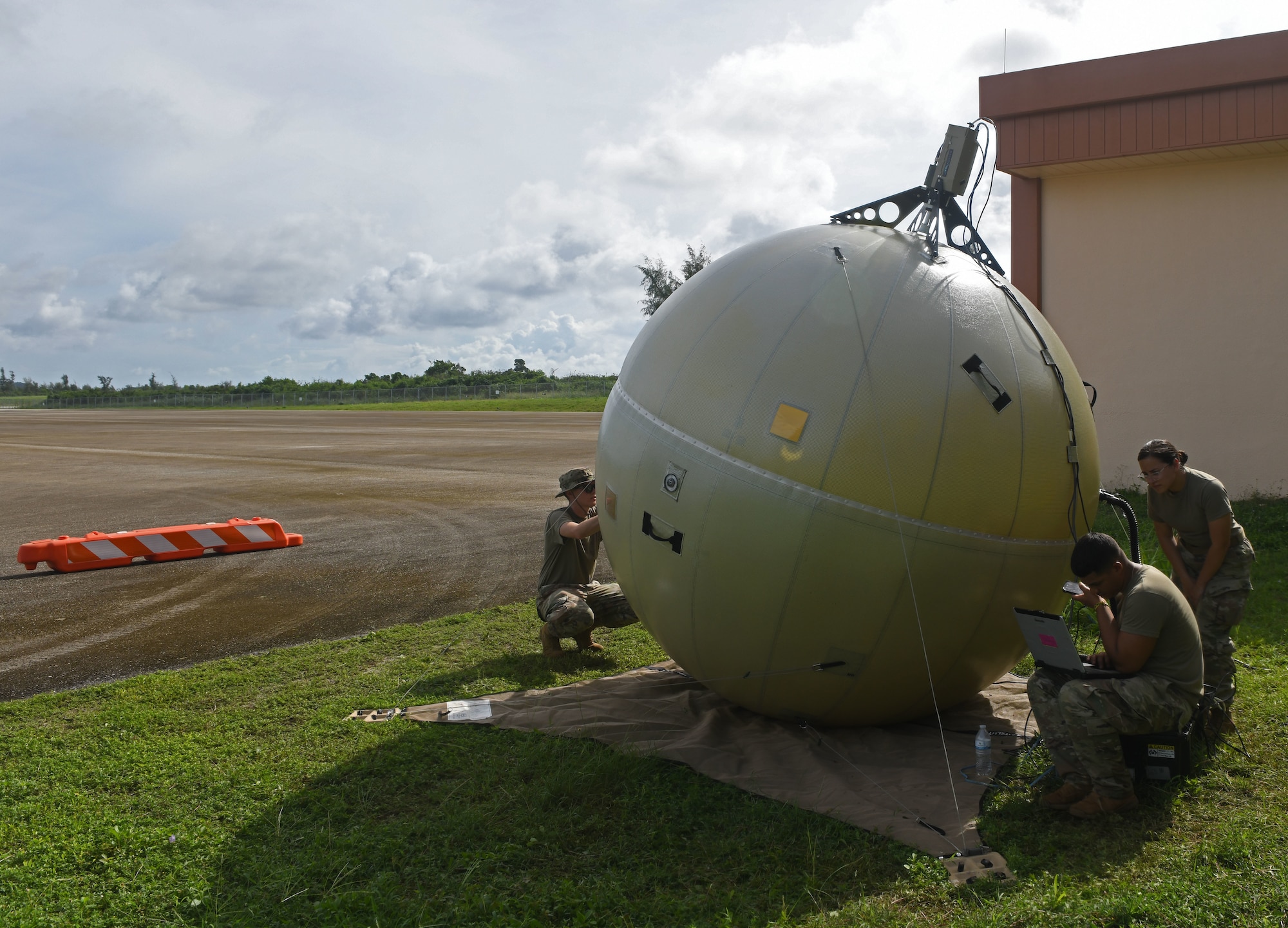Servicemembers from the 644th Combat Communications Squadron, Andersen Air Force Base, Guam, set up network satellite communications through a Ground Antenna Transmit and Receive at Tinian International Airport, Tinian, during Pacific Iron 2021, July 26, 2021. Pacific Iron 2021 is a Pacific Air Forces dynamic force employment operation to project forces into USINDOPACOM’s area of responsibility in support of the 2018 National Defense Strategy which called on the military to be a more lethal, adaptive, and resilient force. (U.S. Air Force photo by Tech. Sgt. Benjamin Sutton)