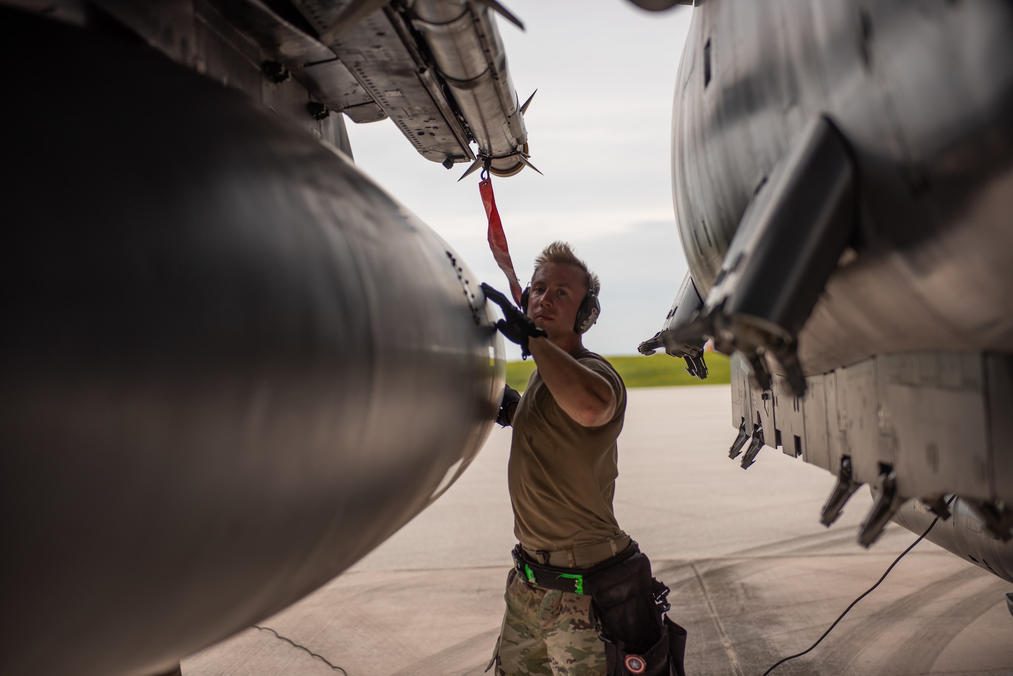U.S. Air Force Staff Sgt. Zachary Williams, weapons standardization load crew chief assigned to the 389th Fighter Squadron, post loads an AIM-9X while conducting an Integrated Combat Turn on Andersen Air Force Base, Guam, July 24, 2021. Performing ICTs decreases the aircrews' time on the ground and increases the Air Force's ability to meet new challenges in dynamic environments. (U.S. Air Force photo by Airman 1st Class Andrea Rozoto)