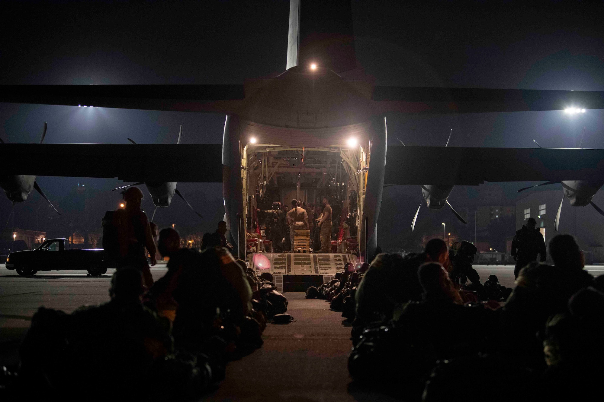 Japan Ground Self-Defense Force soldiers with the 1st Airborne Brigade wait to board a C-130J Super Hercules assigned to the 36th Airlift Squadron during Exercise Forager 21 at Yokota Air Base, Japan, July 29, 2021.