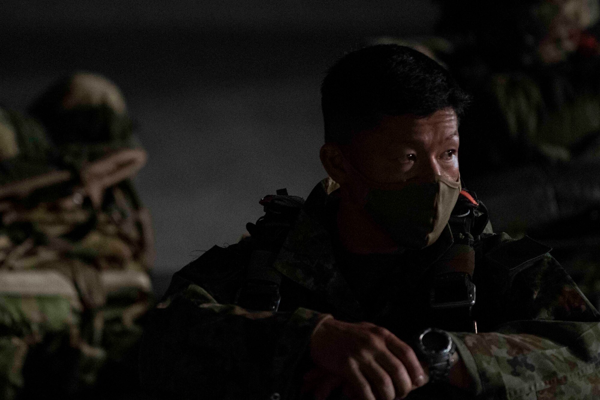 A Japan Ground Self-Defense Force soldier with the 1st Airborne Brigade waits to board a C-130J Super Hercules assigned to the 36th Airlift Squadron during Exercise Forager 21 at Yokota Air Base, Japan, July 29, 2021.