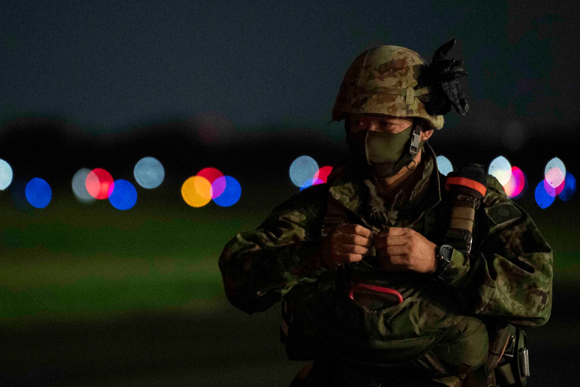 A Japan Ground Self-Defense Force soldier with the 1st Airborne Brigade waits to board a C-130J Super Hercules assigned to the 36th Airlift Squadron during Exercise Forager 21 at Yokota Air Base, Japan, July 29, 2021.