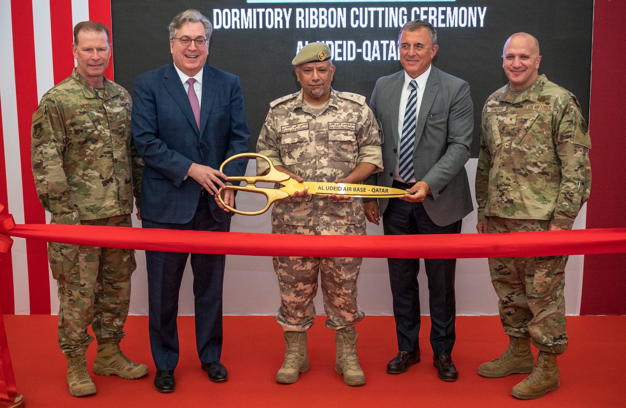 Distinguished guests from the U.S. Embassy in Qatar, Qatar Emiri Corps of Engineers, U.S. Air Forces Central and Bahadir Construction Engineering Contracting and Trading Company pose for a photo during the ribbon cutting ceremony for the new Blatchford-Preston Complex dormitories Aug. 3, 2021, at Al Udeid Air Base, Qatar.