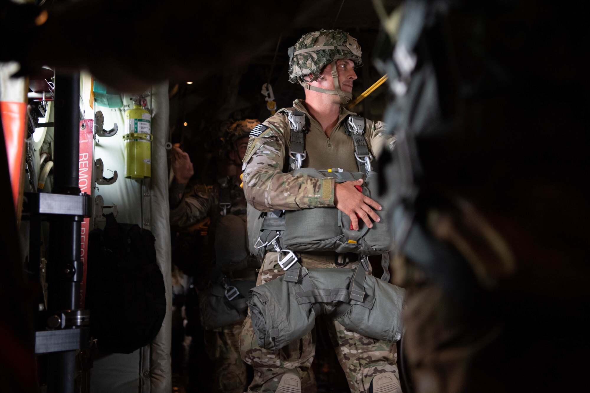Soldier standing on aircraft.
