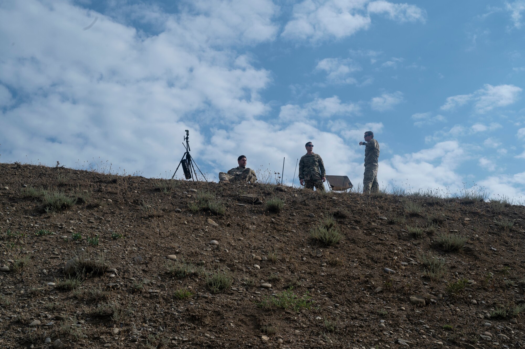 Three U.S. Air Force Airmen assigned to the 435th Contingency Response Group provide dropzone assistance to the U.S. Army and Georgian military forces during exercise Agile Spirit 21