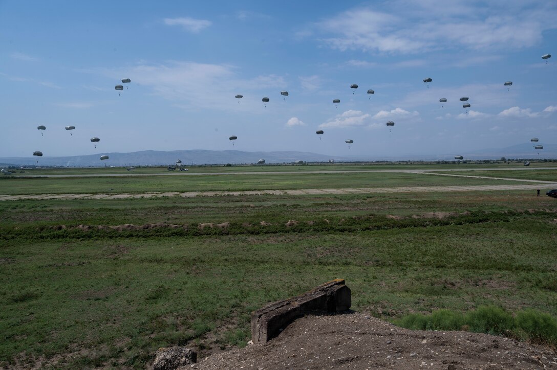 Approximately 150 military personnel comprised of U.S. Army soldiers assigned to the 1st Squadron, 91st Cavalry regiment, 173rd infantry brigade combat team (airborne) and Georgian military forces, perform static-line jumps from U.S. Air Force C-130J Super Hercules aircraft during exercise Agile Spirit 21