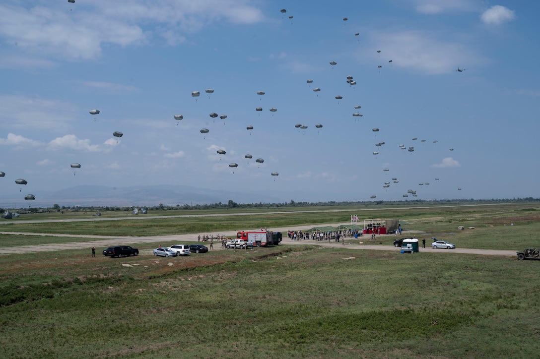 Approximately 150 military personnel comprised of U.S. Army soldiers assigned to the 1st Squadron, 91st Cavalry regiment, 173rd infantry brigade combat team (airborne) and Georgian military forces perform static-line jumps from U.S. Air Force C-130J Super Hercules aircraft during exercise Agile Spirit 21