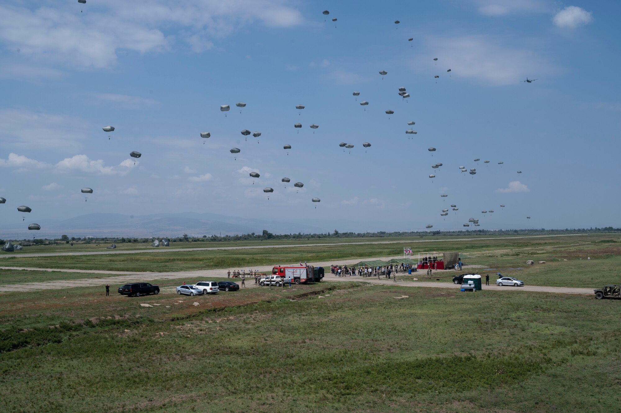 Approximately 150 military personnel comprised of U.S. Army soldiers assigned to the 1st Squadron, 91st Cavalry regiment, 173rd infantry brigade combat team (airborne) and Georgian military forces perform static-line jumps from U.S. Air Force C-130J Super Hercules aircraft during exercise Agile Spirit 21